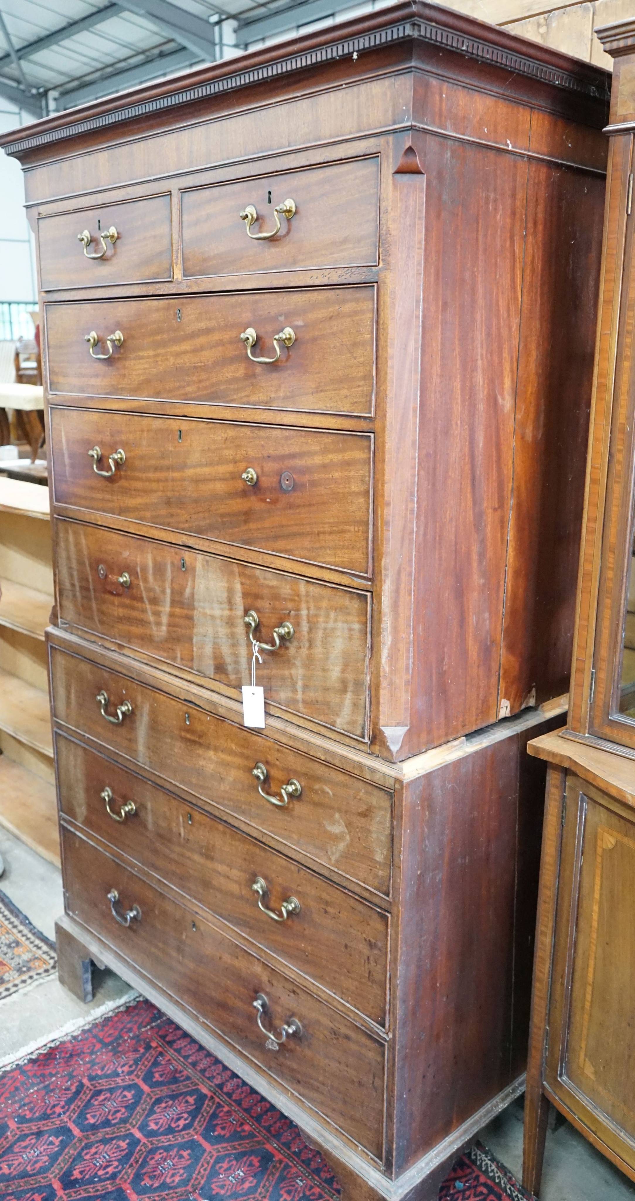 A George III chest on chest, width 106cm, depth 56cm, height 189cm